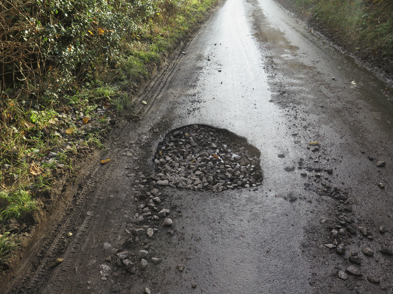 a hole in a country road
