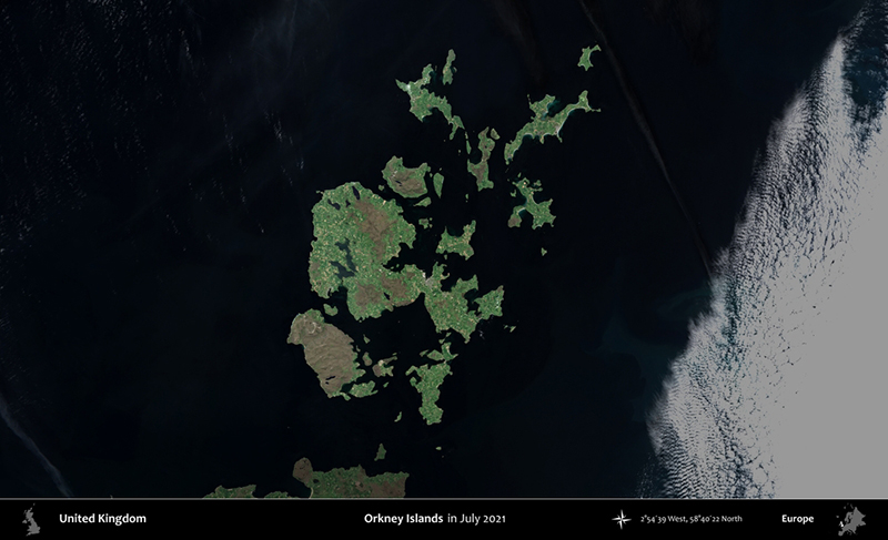 Orkney Islands  highlighted and outlined on a darkened satellite image 
