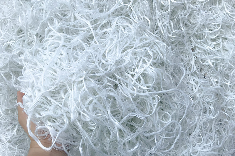 Stock image of recycled white polyester fibres