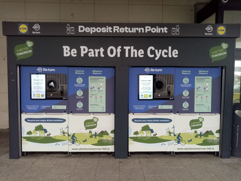 Plastic bottle deposit re-turn point recyclable machine, offering empty bottle deposit refund vouchers outside Lidl supermarket.