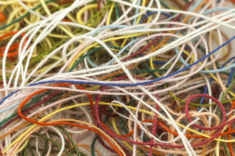 Multicoloured needlecraft silk threads tangled together