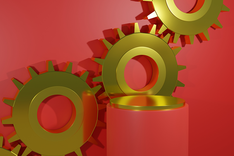 Stock image of gold gears with a podium and red background