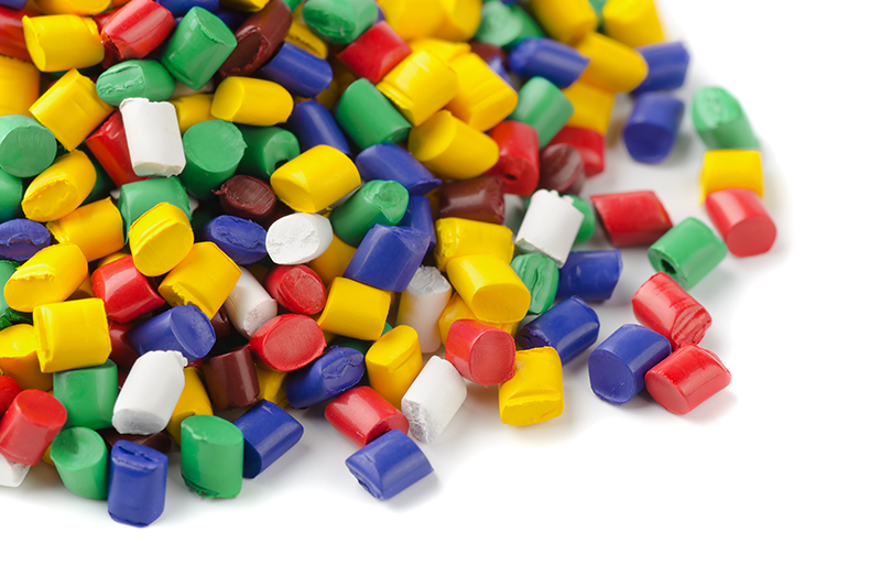Stock image of recycled plastic pellets in various colours
