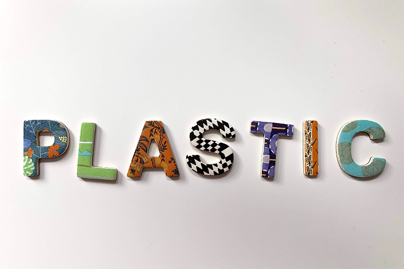 the word plastic spelt out in letters made of various plastics