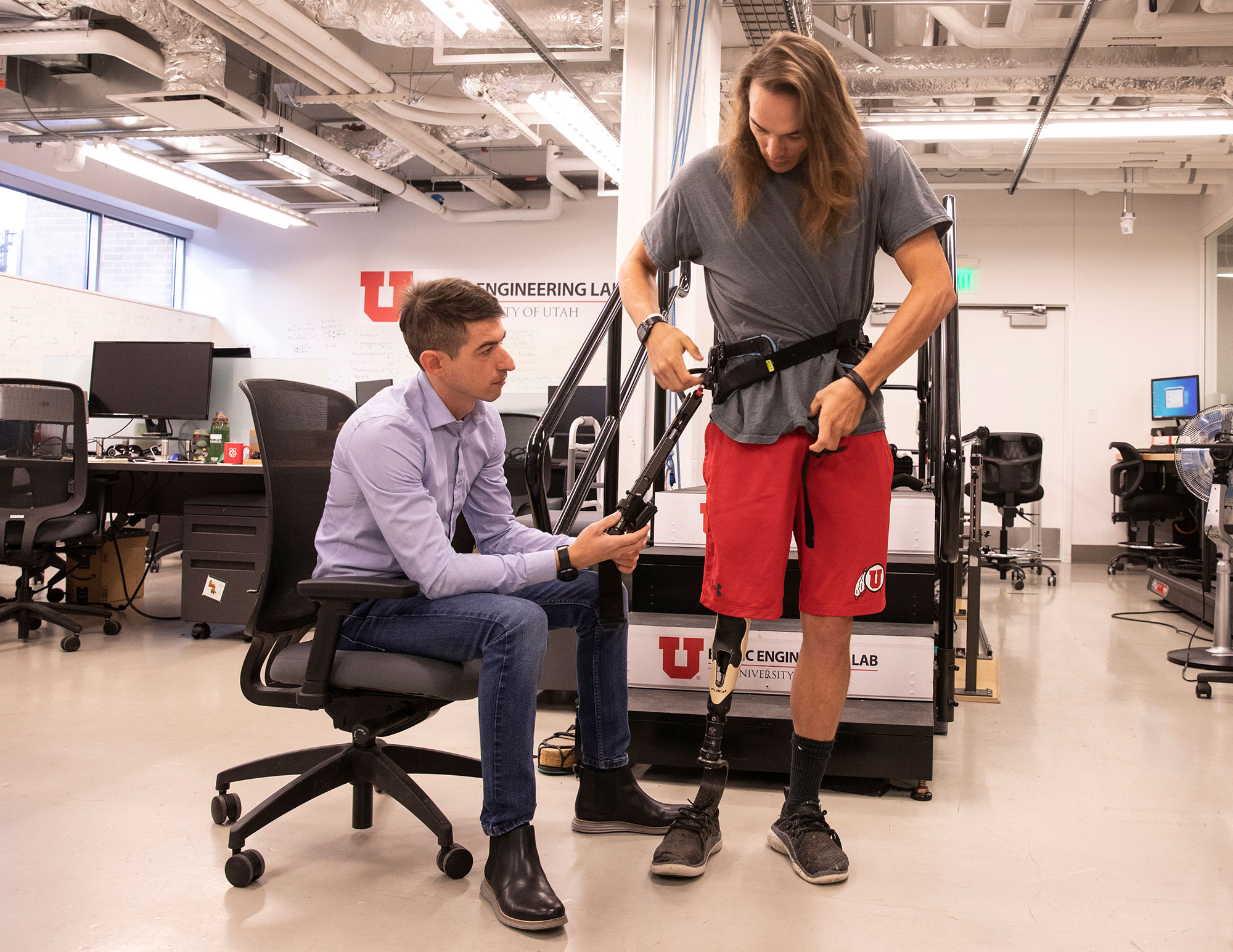 Below: Tommaso Lenzi, of the University of Utah College of Engineering, USA, setting up the experimental exoskeleton designed for lower-limb amputees