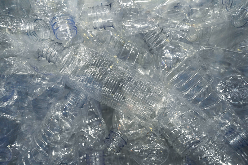 Stock image of empty and crushed clear plastic bottles ready for recycling