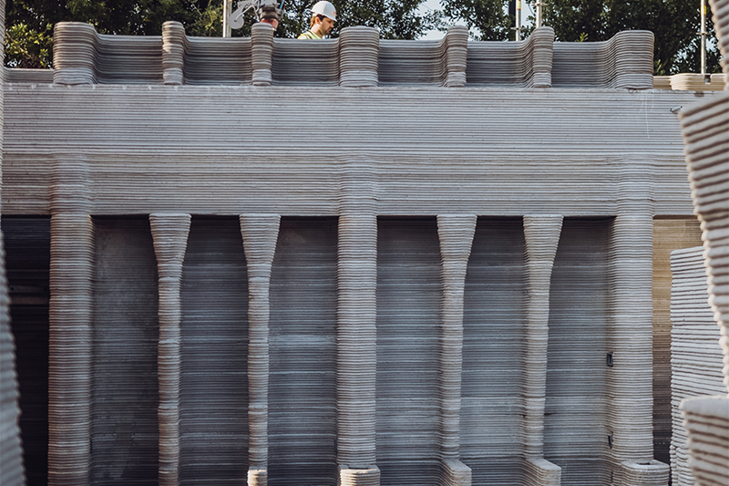 Mulitple thin layers of cement forming the shell of a building