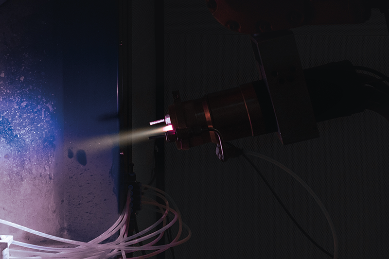 Axial-injection plasma spray torch producing a purple-tinged tungsten-copper coating