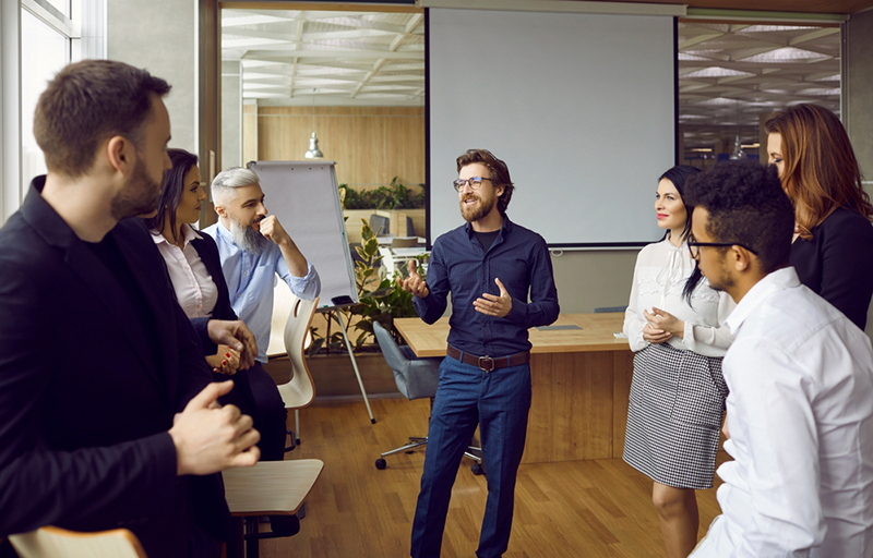 Male presenter talking to group