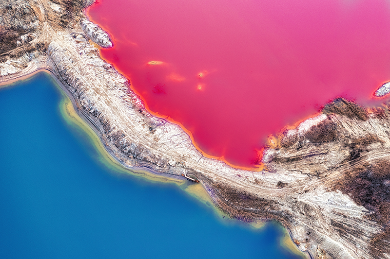 Bright coloured pink and blue mine tailings
