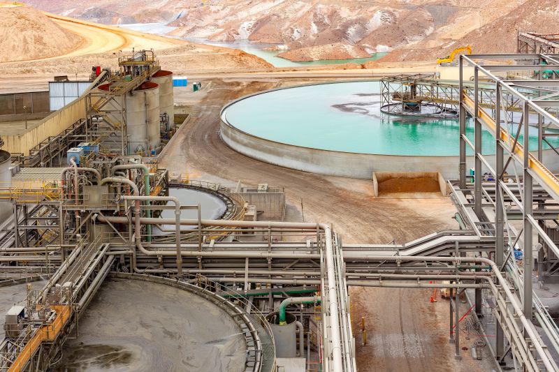 The water treatment facility at a copper mine and processing plant where the technology may be used in the future. Large pool of water pictured in the background to a metal construction