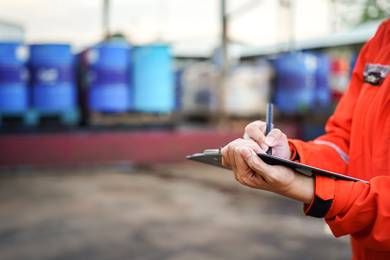Stock image of someone performing checks at a chemical plant