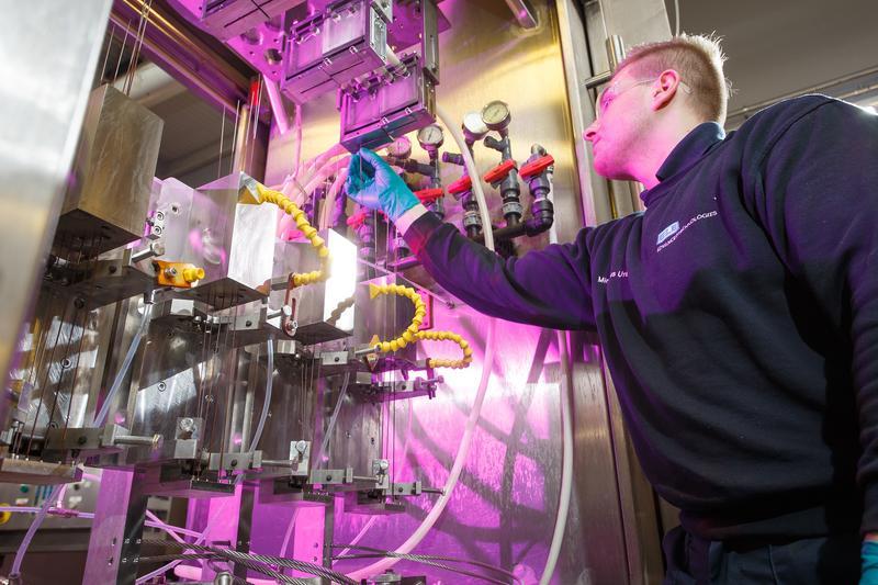  A specialist fixing plumbing pipework in an industrial installation