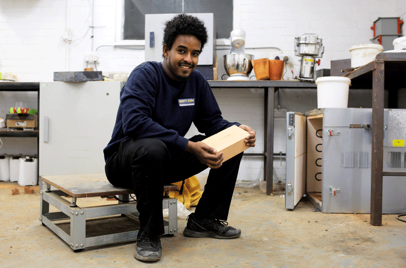 Above: Feysal Shifa with the prototype he designed from waste aggregate