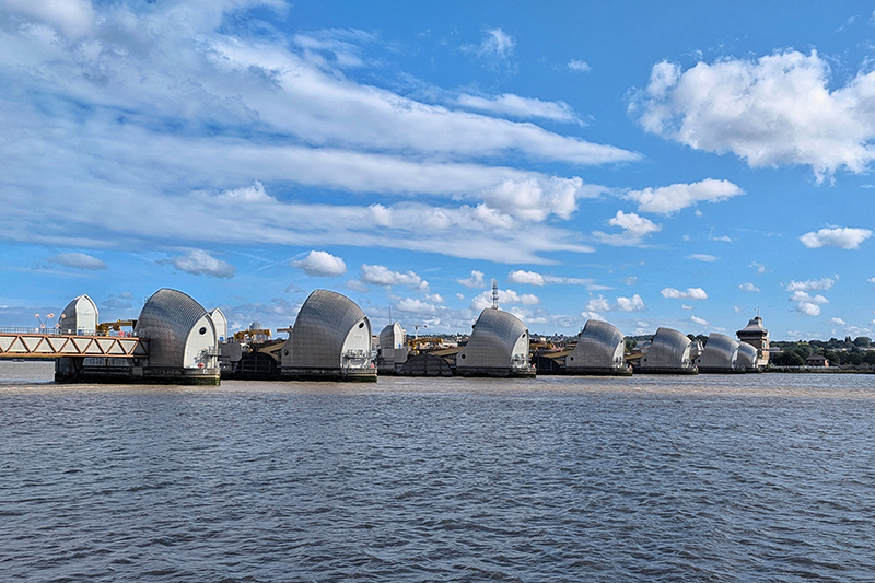 Flood barriers in the River Thames against a blue sky