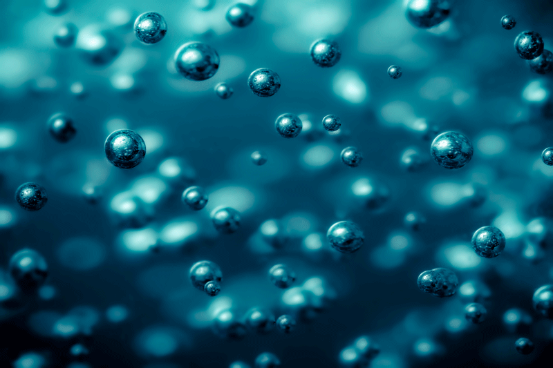 A close up image of bubbles in a liquid