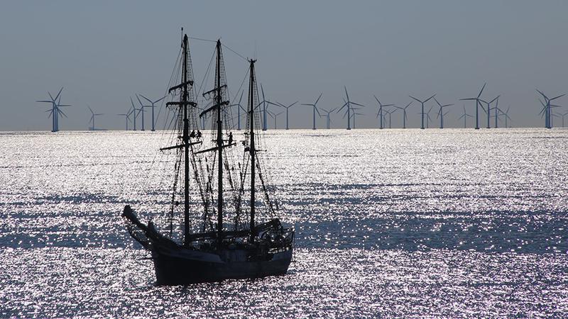 Sailing ship and windfarm