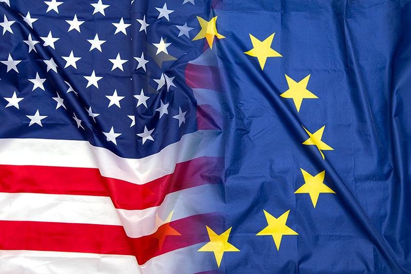 Stock image of EU and US flags flowing into each other