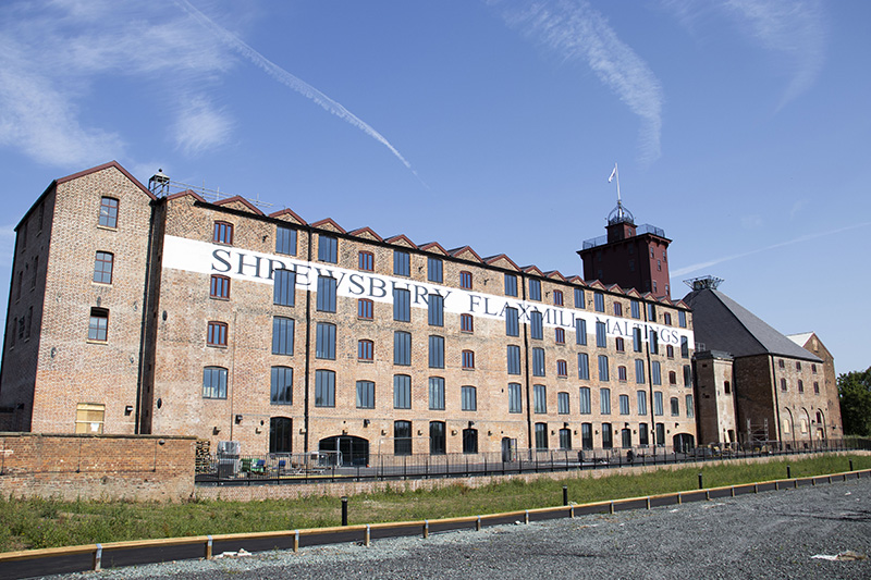 large red-bricked five storey warehouse