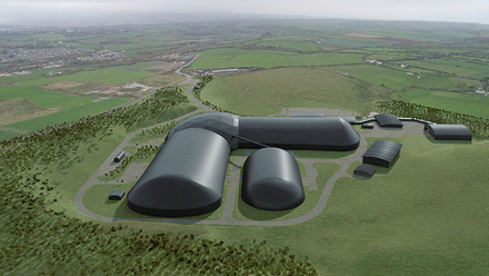 A digital image of a futuristic building complex made up of smooth, black, capsule like buildings and domes. Surrounded by fields. 