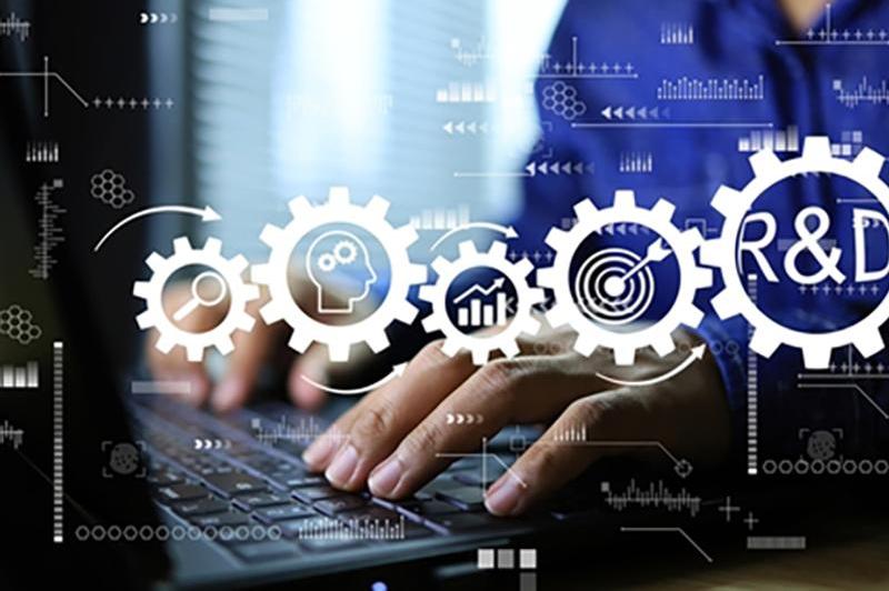 Abstract graphic of cogs in front of someone researching and last one says R&D