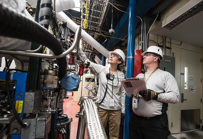 NREL Thermochemical Process/ Control Engineer and Research Technician at work 