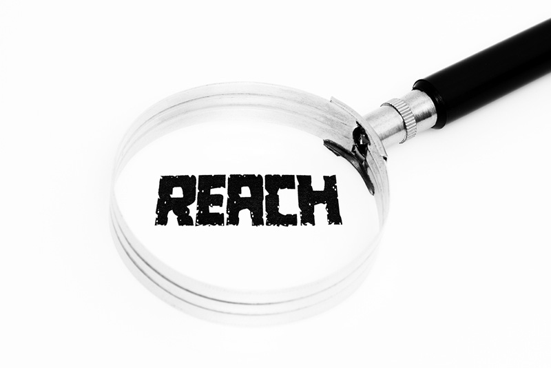 magnifying glass on the word REACH 