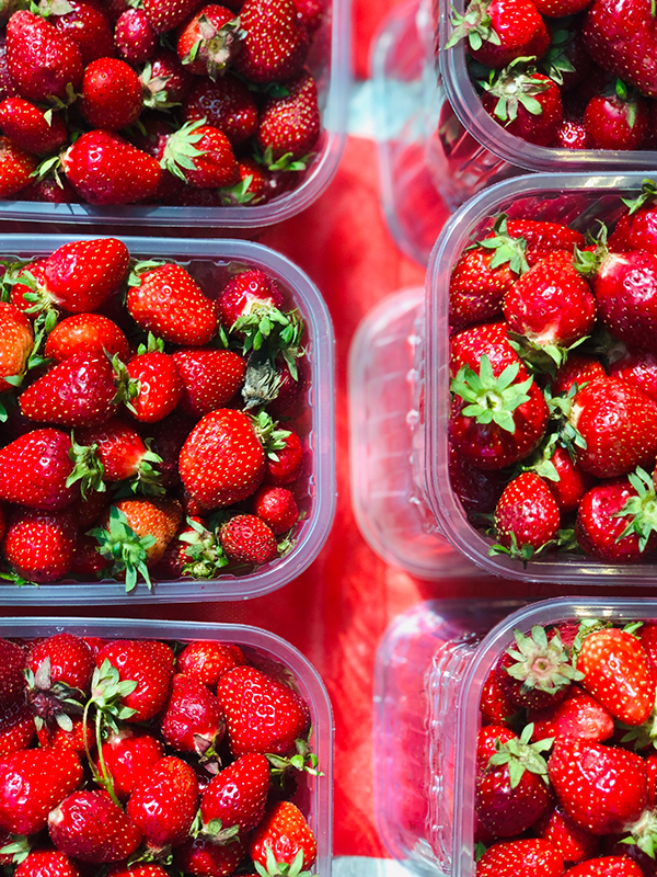 six punnets of strawberries, each partially shown