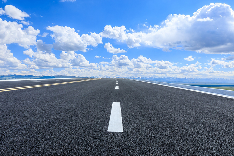 Asphalt road and sky with clouds natural landscape