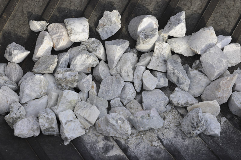 Spodumene hard rock ore on conveyor belt