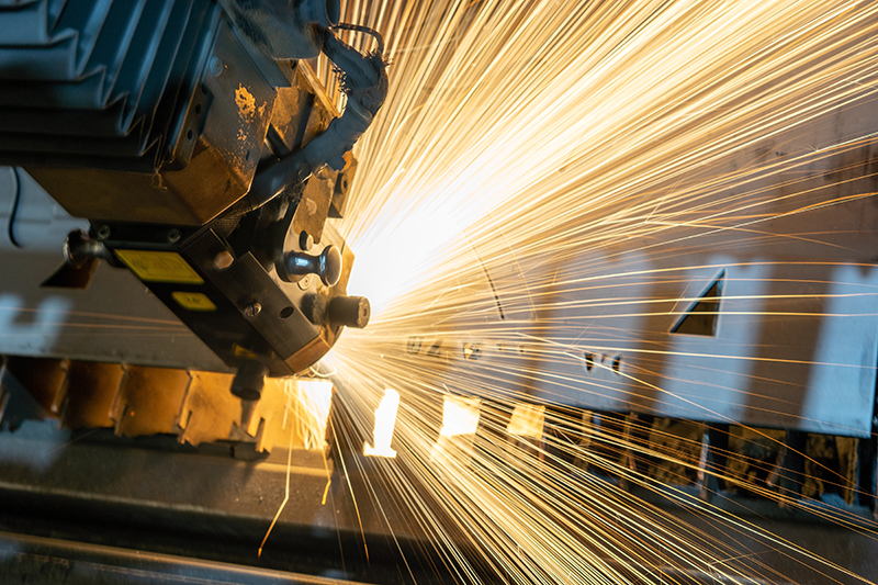 machining a piece of metal, sparks fly