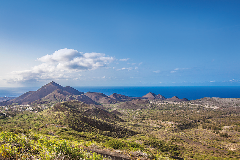 Ascension Island under a blue sky, home to a dormant volcano