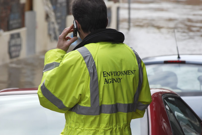 Man in high visibility environment agency overalls