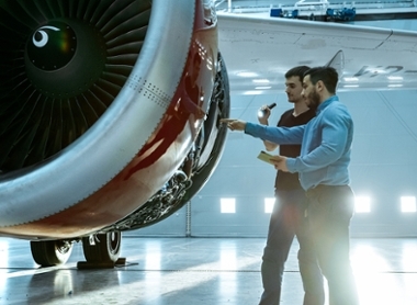 shutterstock_1161854005-Hangar Aircraft Maintenance Engineer and Airplane Technician, Jet Engine. Plane.jpg