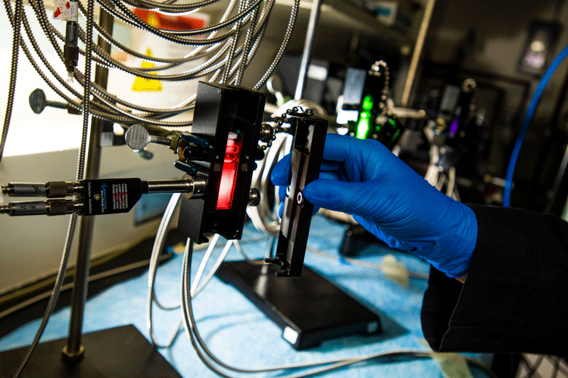 Pacific Northwest National Laboratory researchers use three different Raman systems based on different excitation wavelengths to identify chemical species within radioactive waste samples retrieved fr