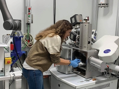 Dr Alexandra Cackett loading a sample into the MRF’s scanning electron microscope