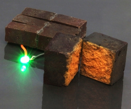 A brick supercapacitor powering an LED light