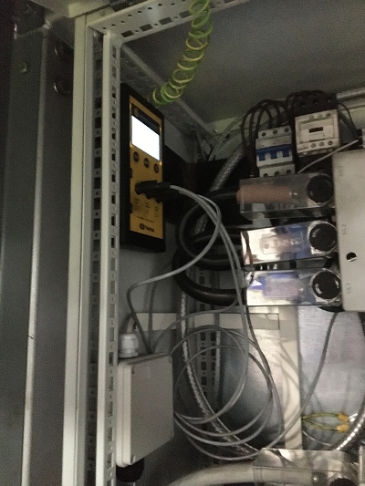 The data energy logger unit (yellow casing) inside the shredder