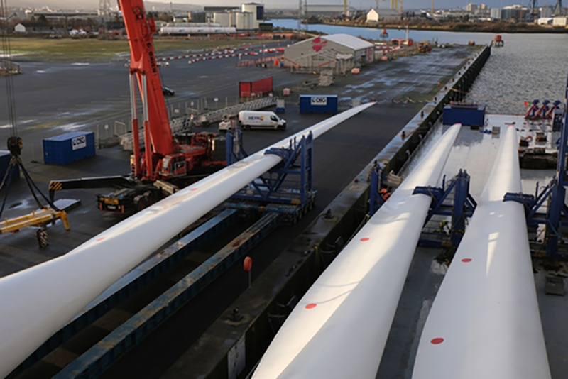 Giant wind turbine blades being loaded at Belfast dock