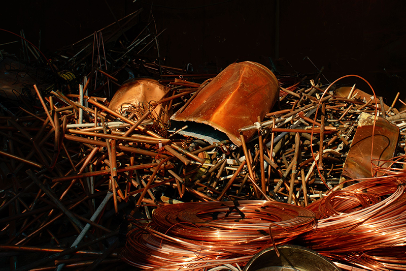 Stock image of scrap copper in a merchant bin