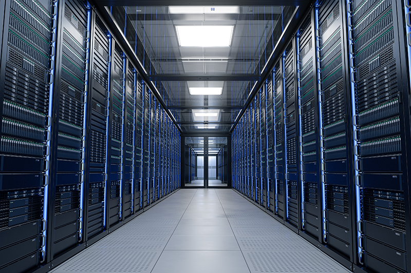 Stock image of a corridor inside a large data centre, with computers on both walls