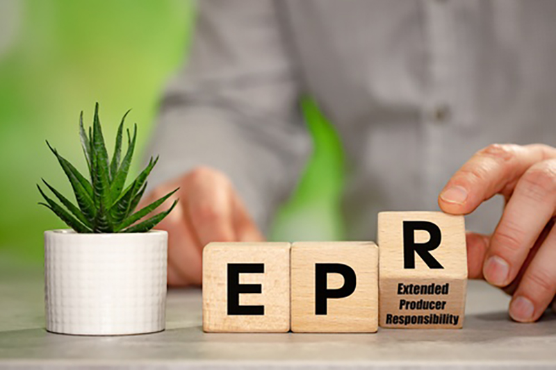 The letters EPR on separate wooden blocks with the R being turned over and underneath says Extended Producer Responsibility