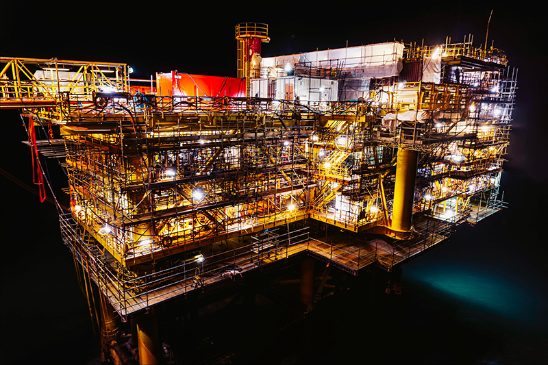 oil rig light up at night