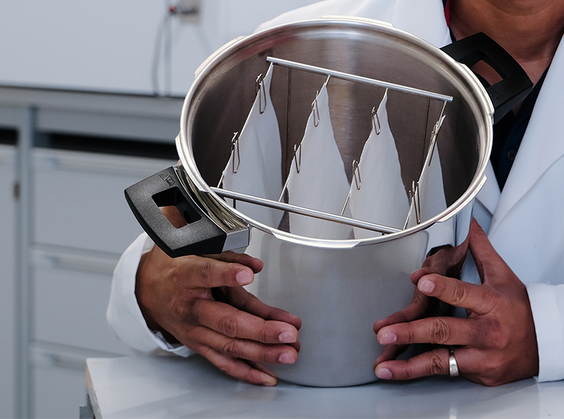 Steam from a commercial pressure cooker is used to make cotton samples flame retardant