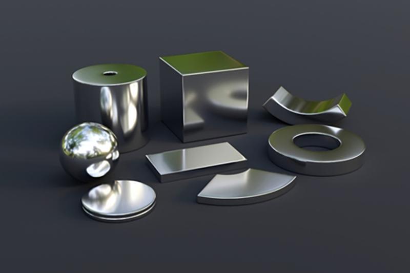 Differently-shaped metal objects on a black background