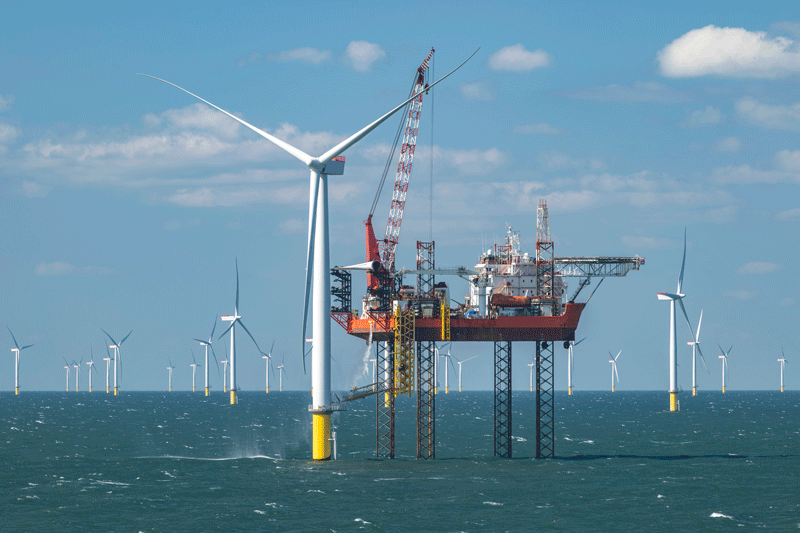 Wind turbines and a platform in the sea