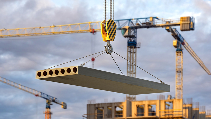 Concrete slab is lifted by construction crane