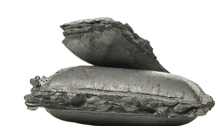 two pieces of sponge steel showing rough edges