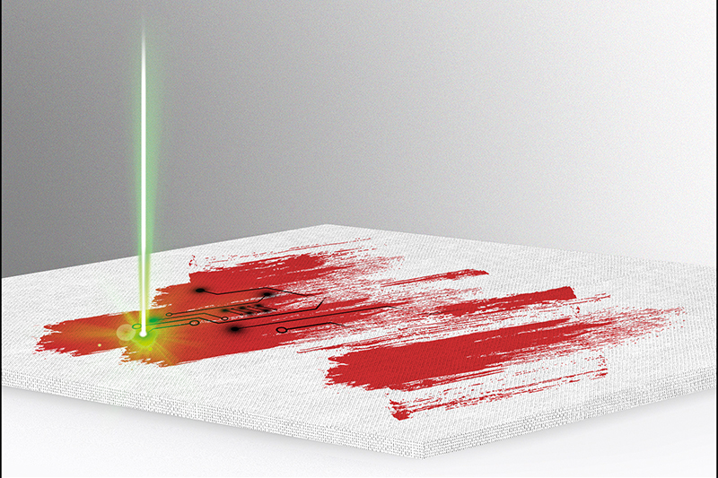 An imaginary laser firing down on-top of red paint-like brush strokes on paper