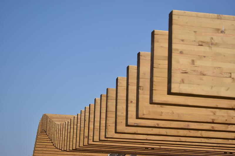 Planks against blue sky